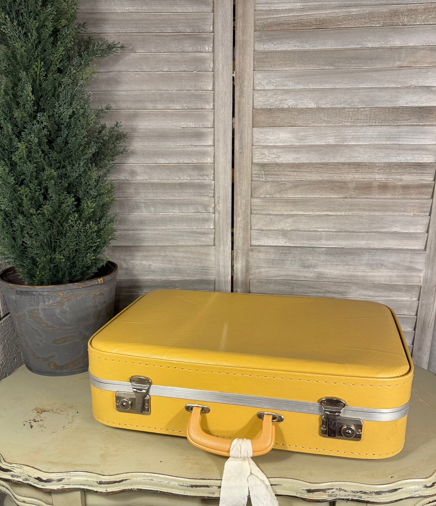 Vintage Yellow Suitcase with Ribbon – Retro Travel Case or Decorative Storage