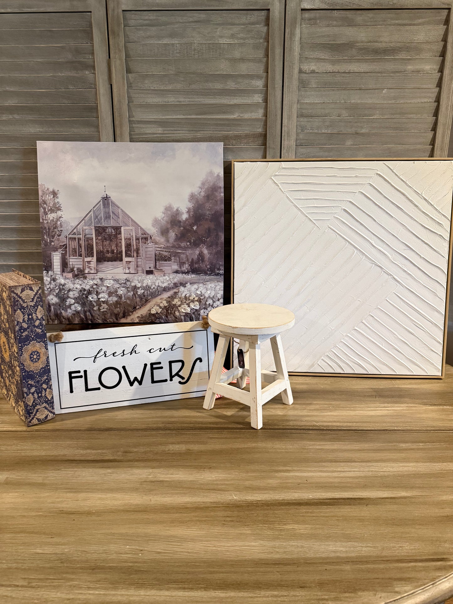Farmhouse-style décor set with a pastel greenhouse print, textured white canvas, ‘Fresh Cut Flowers’ wood sign, floral box, and mini white stool—perfect for cozy cottage-inspired styling."